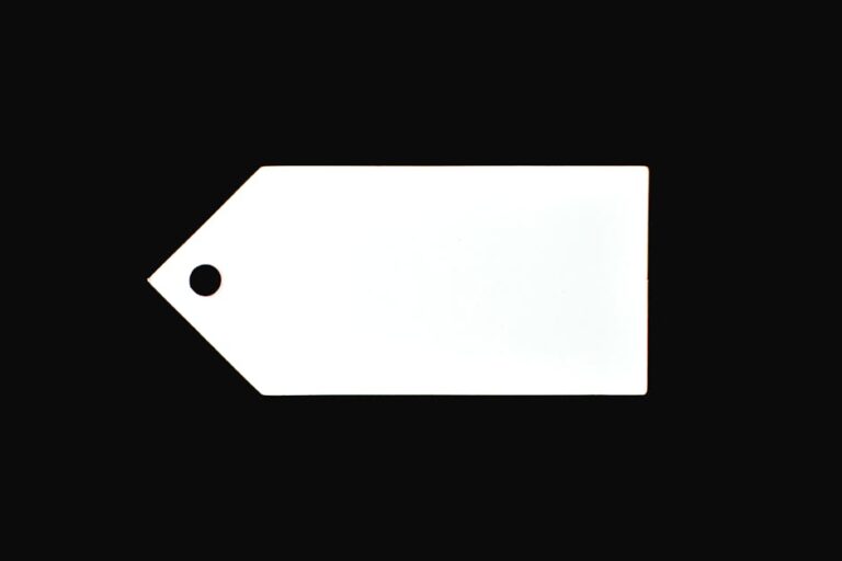 A white blank price tag against a black background, perfect for commercial use.