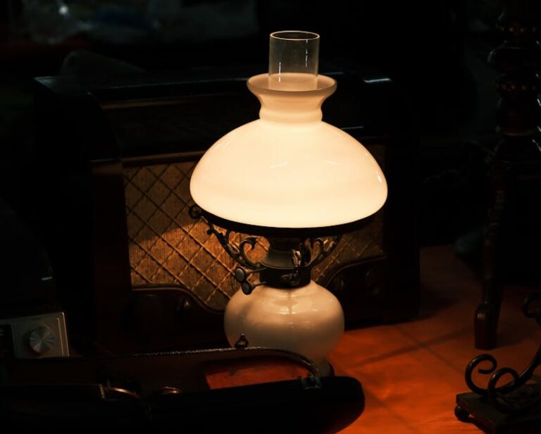 Elegant vintage oil lamp glowing warmly indoors, creating a nostalgic ambiance.