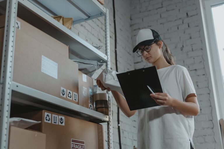 Warehouse worker organizing packages on shelf with clipboard.